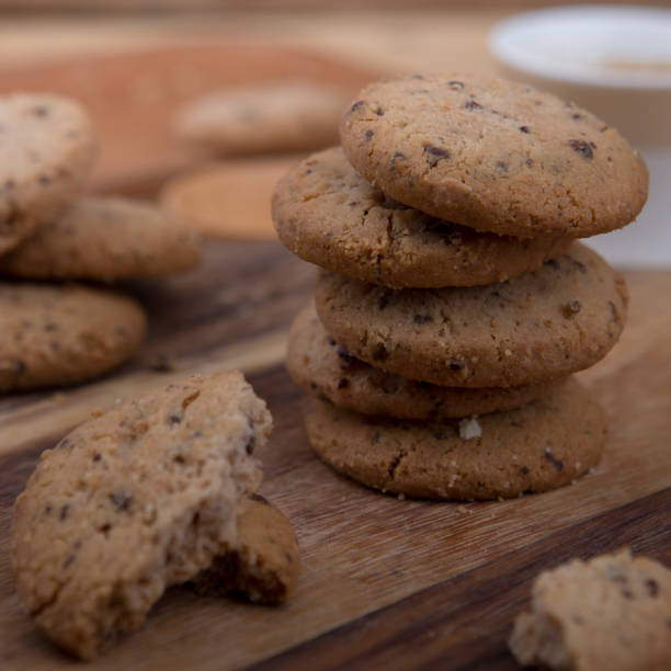 istock Stacked chocolate chip cookie on wooden table 1148992272