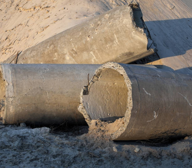 istock Concrete pipes (tubes) near the sand pile 1148993168
