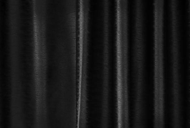 istock Luxury black silk curtain texture for background and design art work. 1148994384