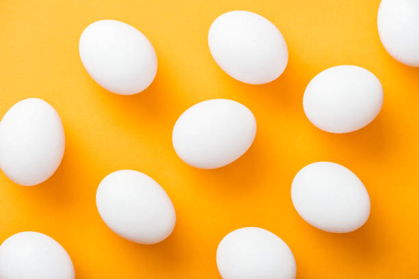 istock top view of whole white fresh chicken eggs on bright orange background 1148997511