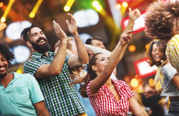 istock Friends dancing at a concert. 1148999132