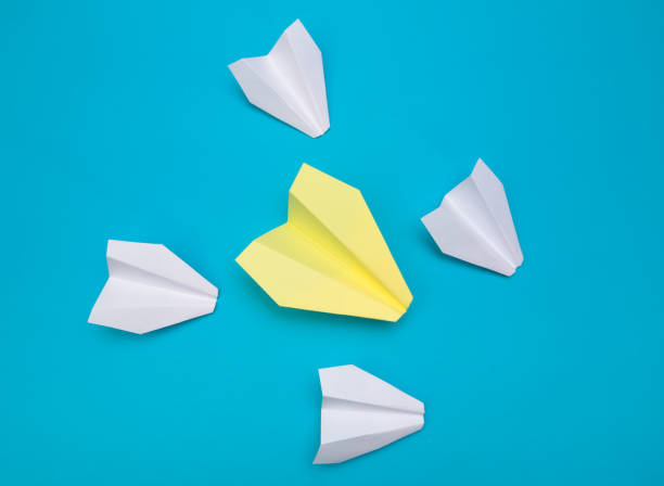 istock winner  paper aircraft on blue background - Image 1149005648