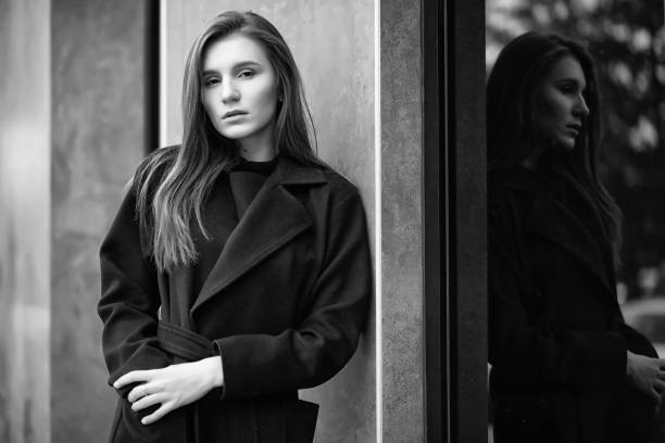 istock Girl in a coat black and white photo 1149006376