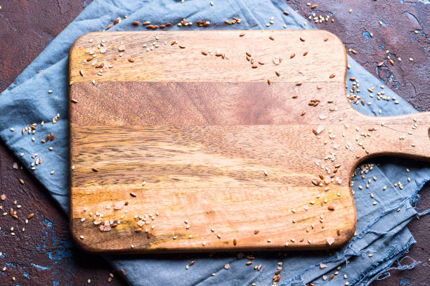 istock Brown textured background with napkin and board 1149008797