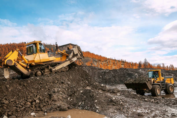 istock The bulldozer and loader work together in a mountainous area 1149009802