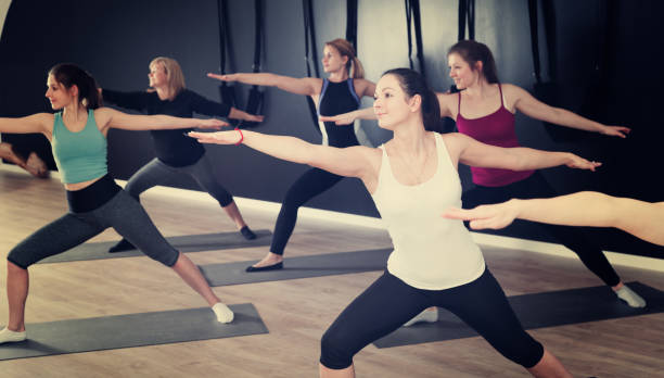 istock Females exercising during yoga class 1149011927