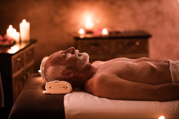 istock Senior man relaxing on a massage bed at the spa. 1149012752