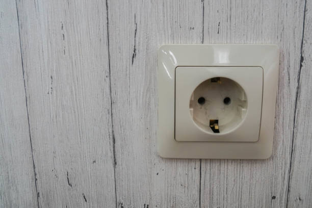 istock close up plug socket outlet on the wooden house wall 1149012929