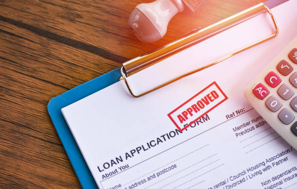 istock Loan approval / financial loan application form for lender and borrower for help investment bank estate 1149015028