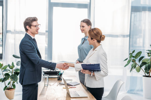 istock happy employee shaking hands with recruiter on job interview 1149015120