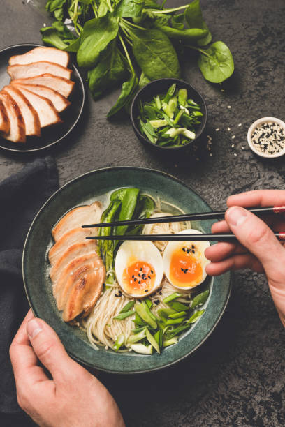 istock Eating japanese ramen noodle soup 1149018979