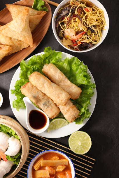 istock selection of asian meal with spring roll, samosa, fried noodles, soup 1149019169