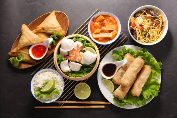 istock selection of asian meal with spring roll, samosa, fried noodles, soup 1149019186