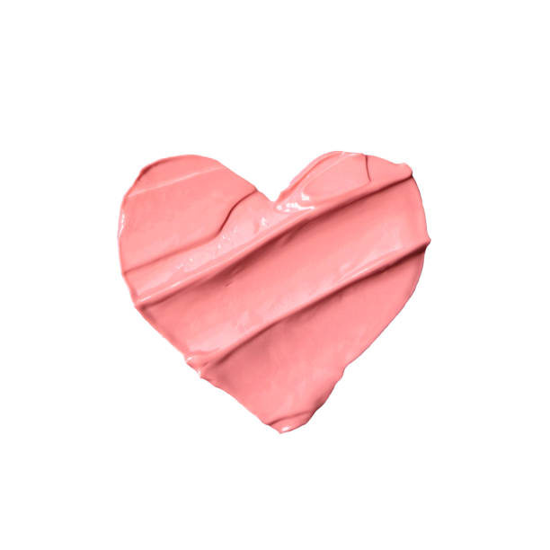 istock Heart from liquid pink lipstick isolated on white background 1149021200