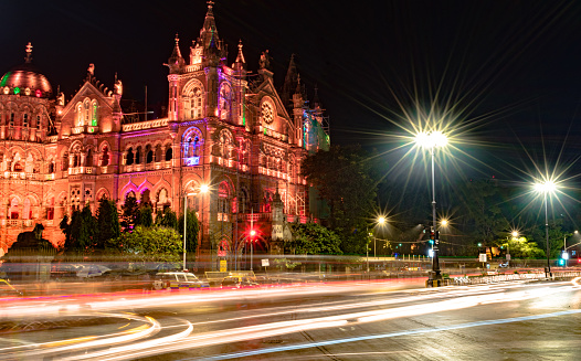 Iconic Victoria Terminus of the financial capital of India, Mumbai, and the traffic trails during the night hours. This iconic building is a UNESCO world heritage site and is also known as the Chhatrapati Shivaji Maharaj Terminus, and also serves as the railway station of the Mumbai suburban Railways which is knwon as the Life Line of Mumbai. This building depicts the remarkable effect of British culture and architecture on todays modern India.