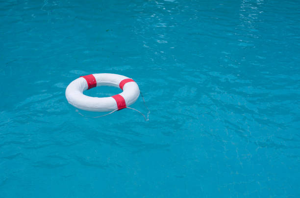 istock Life preserver, Life Buoy floating in a clear pool water 1149029691