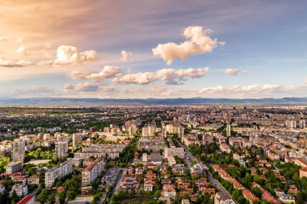 Dramatic sunset over Sofia, Bulgaria during springtime cityscape. The scene is situated in Sofia city capital of Bulgaria (Eastern Europe). The picture is taken with DJI Phantom 4 Pro drone.