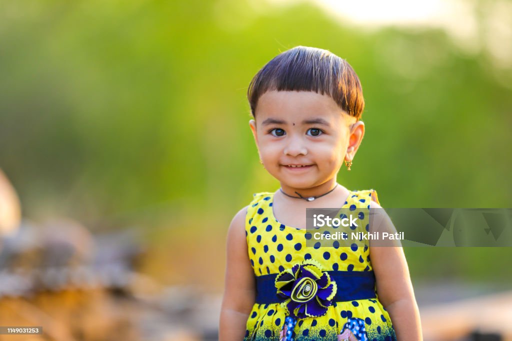 Cute Indian Baby Girl Playing In The Park Stock Photo - Download Image Now  - Animal, Asian and Indian Ethnicities, Beauty - iStock