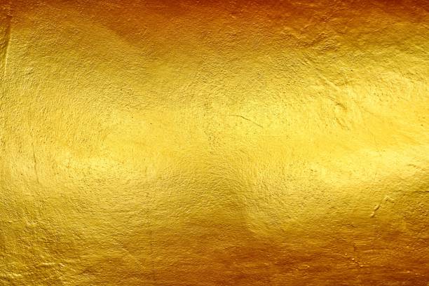 istock Gold Paint on Concrete Wall Texture Background. 1149034254
