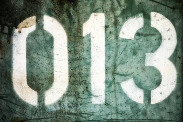 istock Thirteen, a Lucky Number on Grunge Warehouse Wall Background. 1149035025