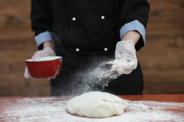 istock the cook makes flour for baking on the table 1149035263