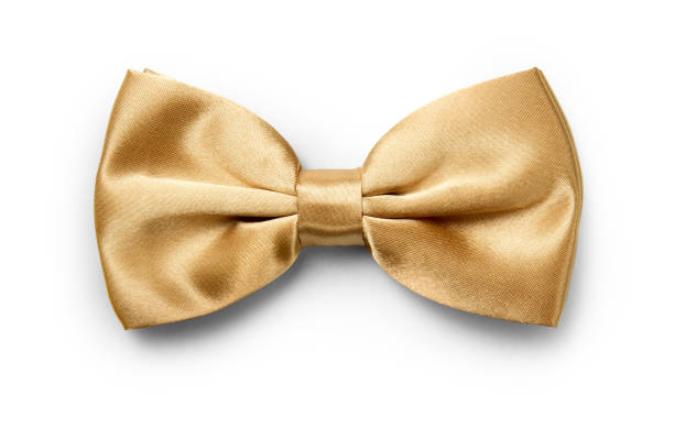 Gold color bow tie isolated on white background with clipping path Gold color bow tie isolated on white background with clipping path neck photos stock pictures, royalty-free photos & images