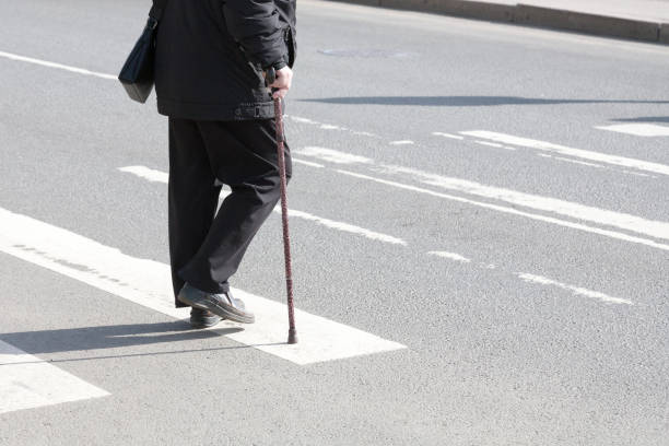 istock the disabled person walks in park on crutches 1149036930