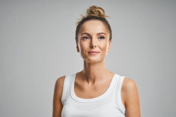 istock Beautiful woman face close up studio on grey 1149037130