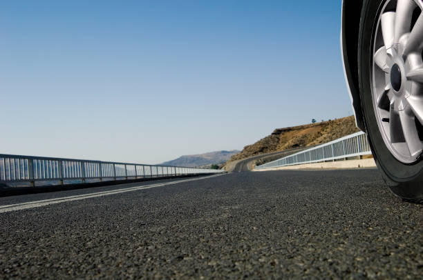 istock Close up front car wheel on the asphalt road 1149037334