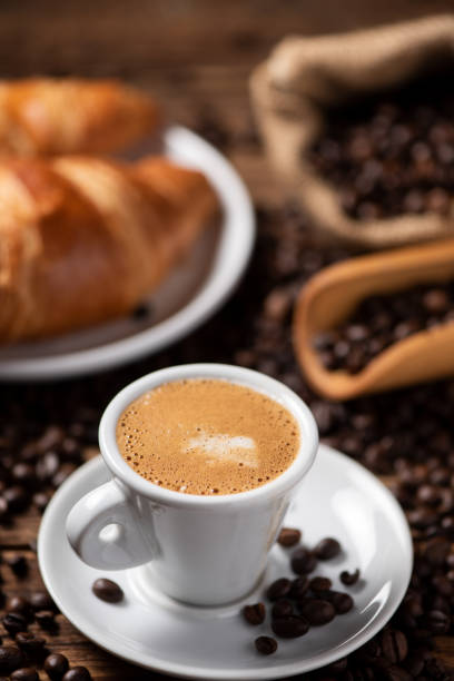 istock A cup of cappuccino with coffee bean as background 1149038518