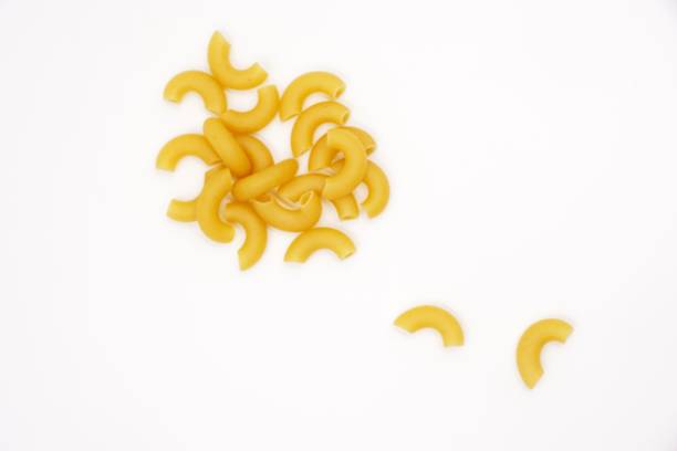 elbow macaroni pasta made from durum wheat - elbow imagens e fotografias de stock