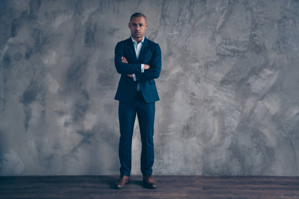 Full length body size view portrait classy charming real estate agent focused concentrated success true leader leadership short hair bald virile wealthy trendy style jacket isolated dark background