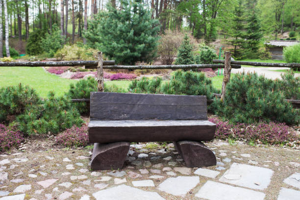 istock Bench from natural wood in summer park 1149041319