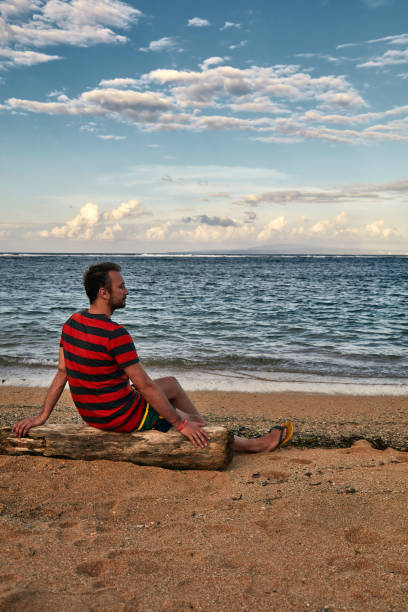 istock Man enjoying on a deserted tropical beach. 1149041991