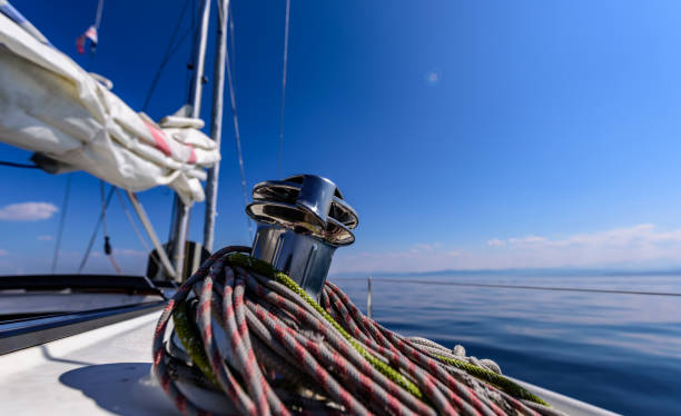 istock Winch on a sailboat with a lot of ropes around it. 1149046370