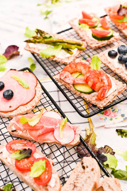 istock Summer snack sandwiches on a white wooden background with different compositions. 1149047656