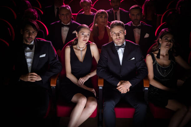 istock Beautiful couple watching theatrical performance 1149047955