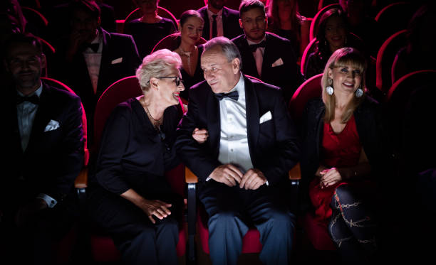 istock Elderly couple talking while sitting in theater 1149048790