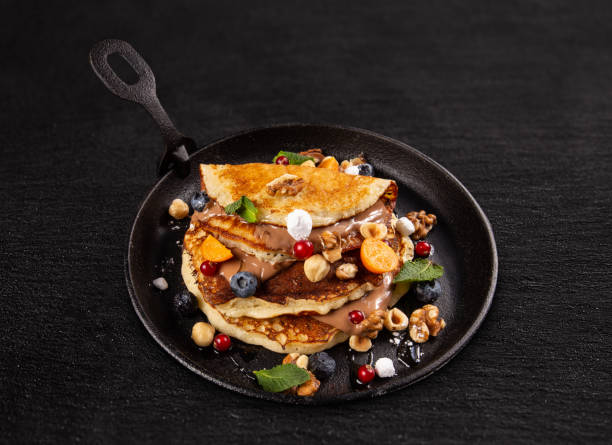 istock Pancakes with berries and chocolate sauce 1149048809