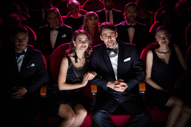 istock Happy couple watching theatrical performance 1149049190