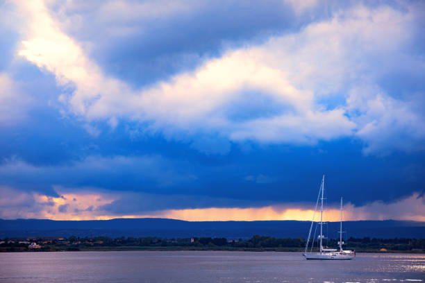 Seascape sail boat at sunset