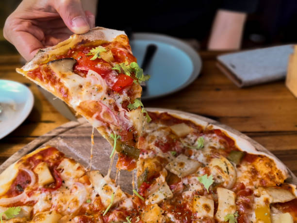 istock People Hands Taking Slices Of Pizza. 1149049391