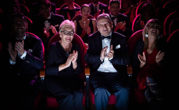 istock Senior couple applauding in opera theater 1149050217