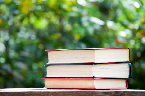 istock book wooden table tree bokeh nobody 1149050521