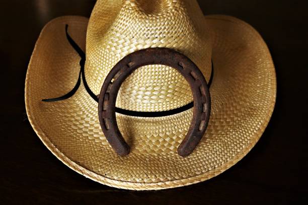 istock Cowboy Hat and Horseshoe Isolated on Black Background 1149050537