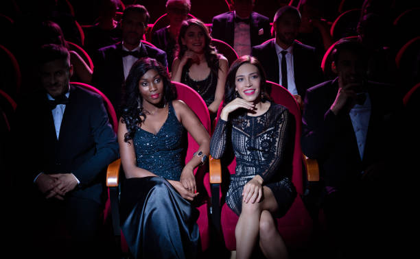istock Young woman in spot lit watching opera 1149050588