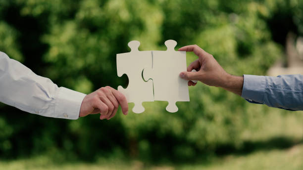 istock Matching puzzles. Business teamwork metaphor 1149051435