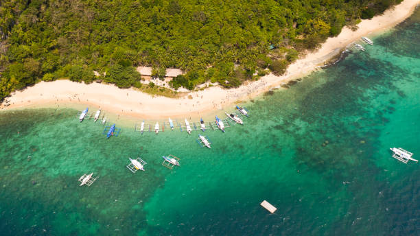 istock Tropical white sand beach. Island with a blue lagoon 1149051444
