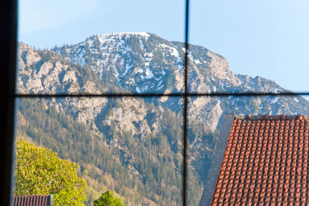 view through a window onto a mountain - home interior cabin shack european alps imagens e fotografias de stock
