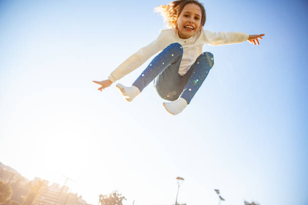 istock Happy Young Girl in Mid-air 1149054504